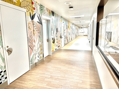 ARMC Health Unite section hallway with colorful leafy wallpaper